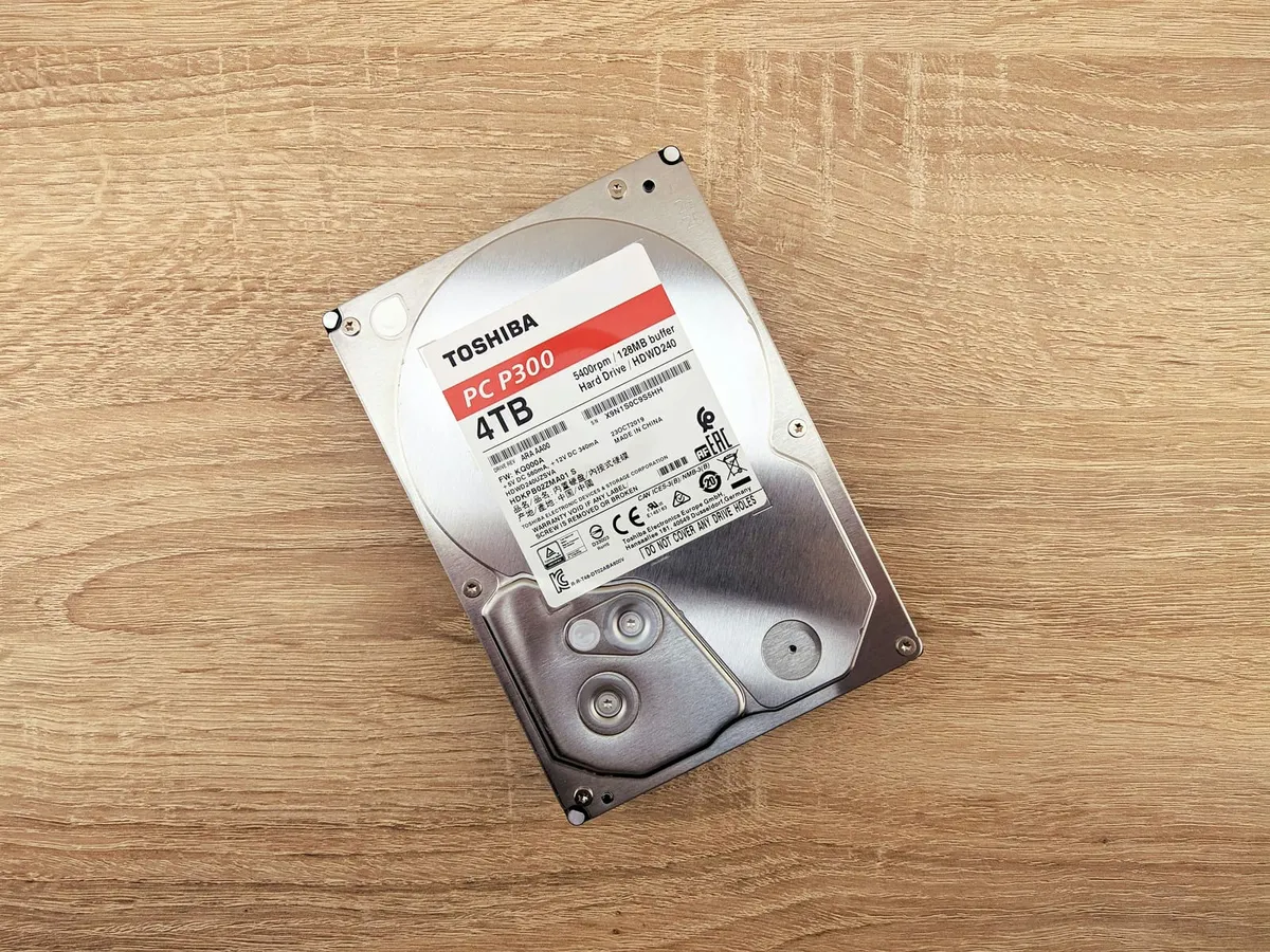 Four-terabyte Toshiba hard disk drive on a wooden surface